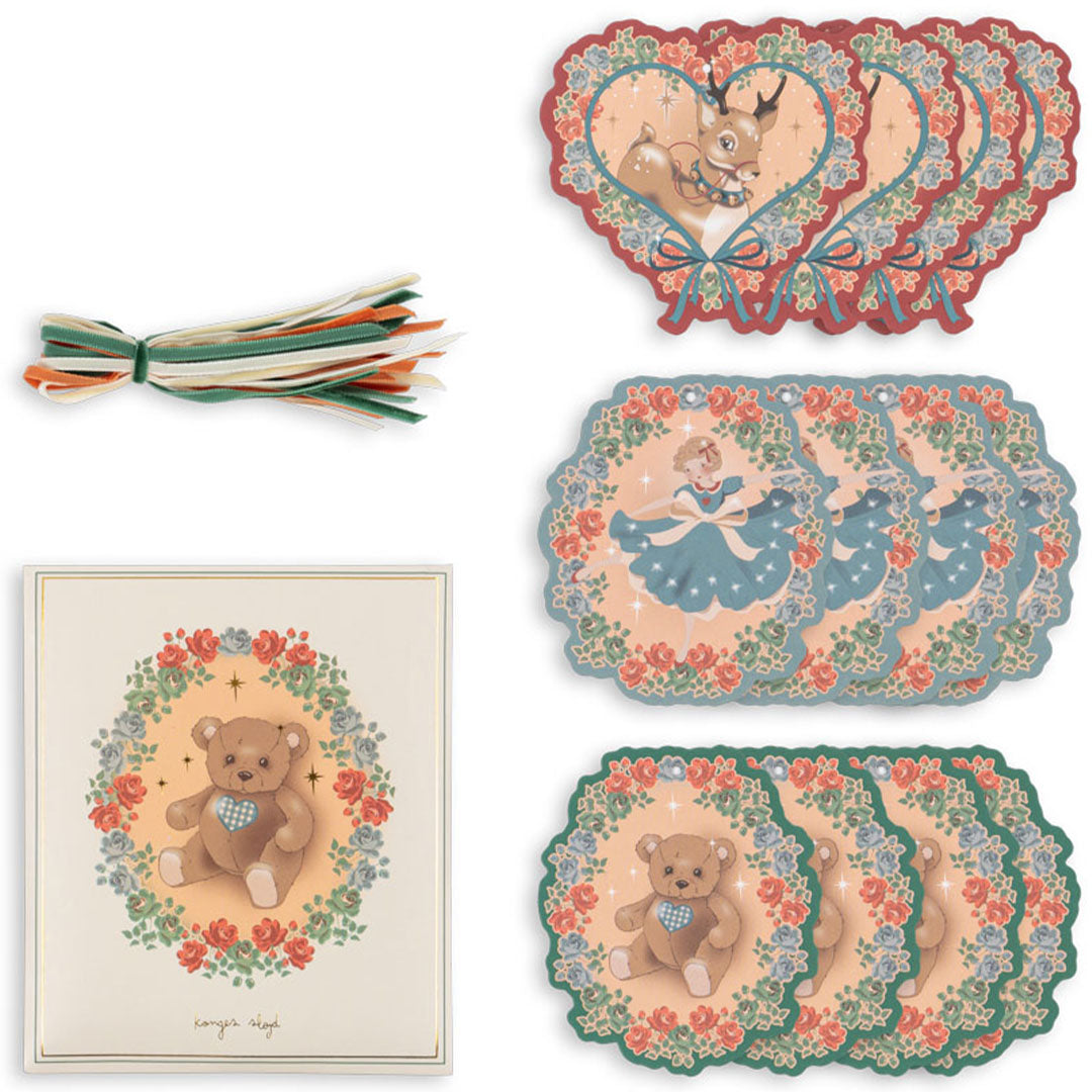 Een set konges sløjd cadeaulabels met herten, teddyberen en ballerina's, en een bosje linten.