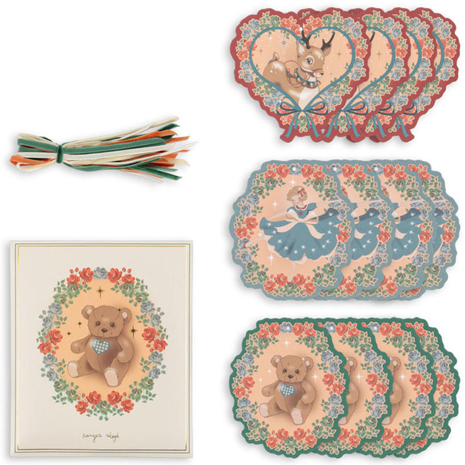Een set konges sløjd cadeaulabels met herten, teddyberen en ballerina's, en een bosje linten.