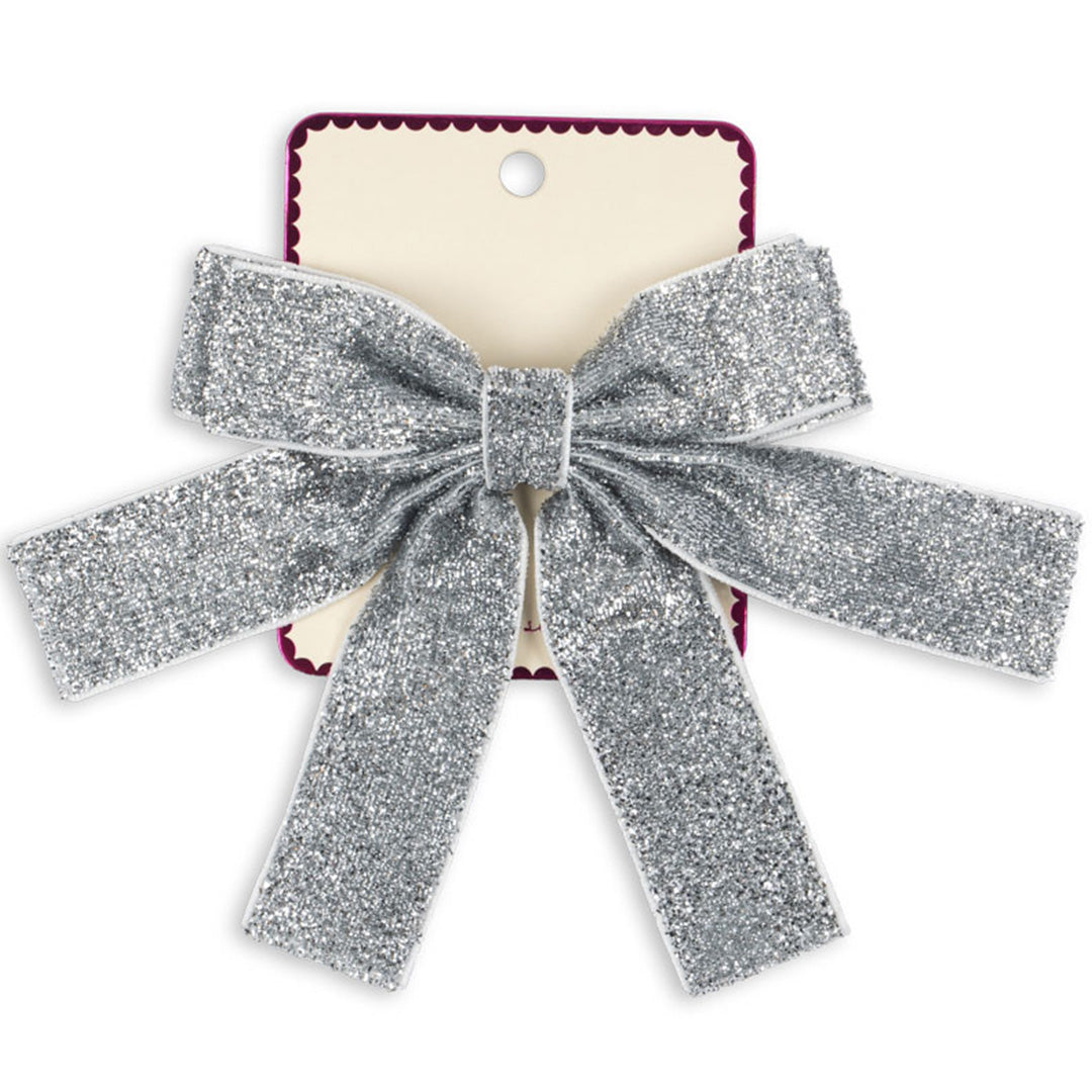 Konges Sløjd zilveren glitter fluwelen haarclip op een productkaart.