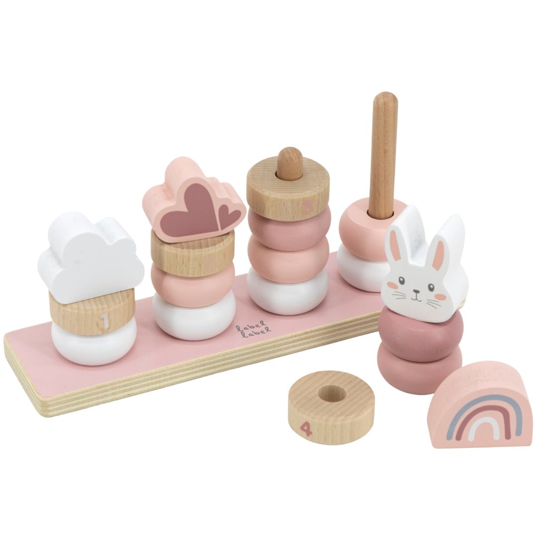 De Label Label houten stapeltoren met roze, witte en naturelkleurige ringen, deels uit elkaar gehaald, met een konijn, regenboog, wolken en harten.