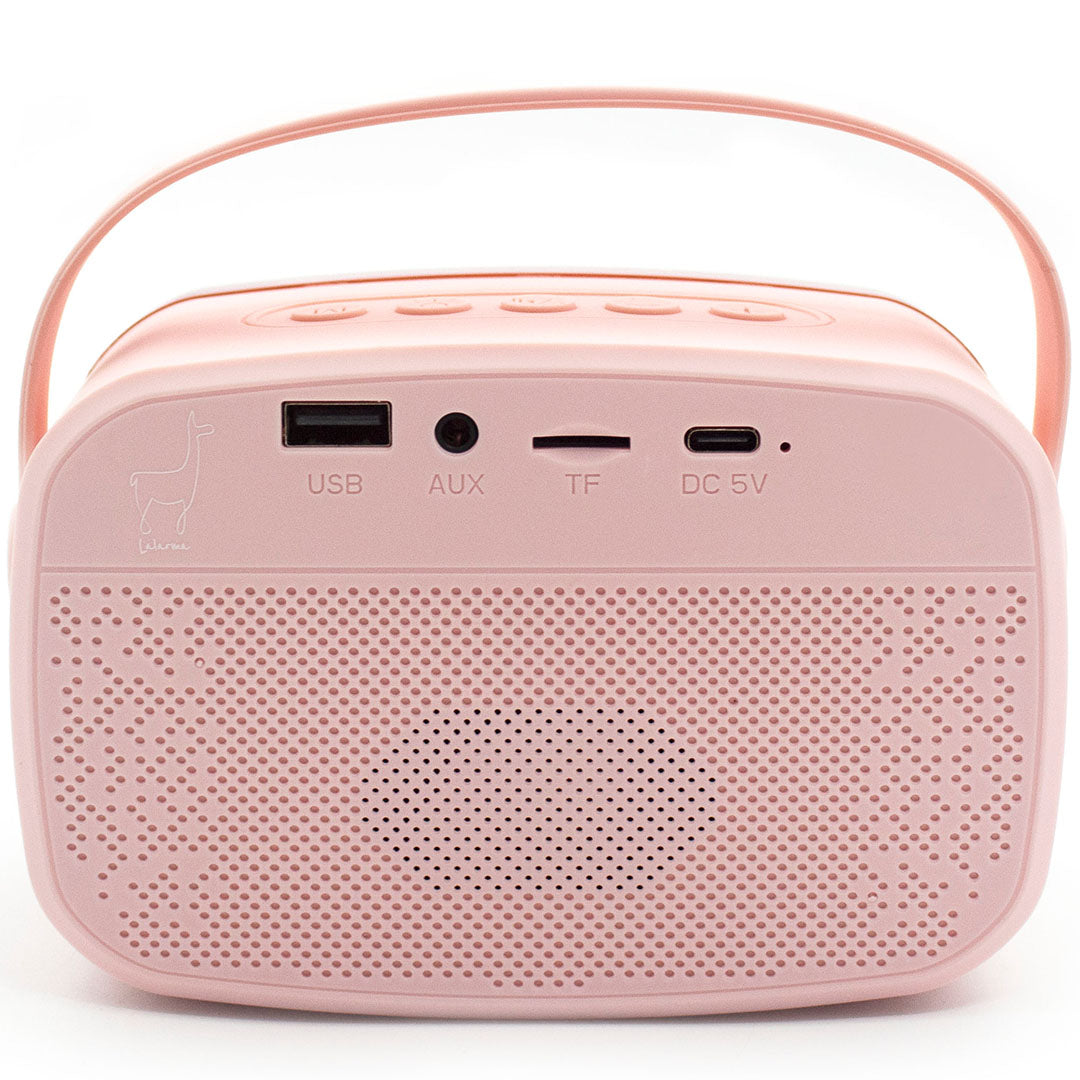 Achteraanzicht van de roze karaokespeaker met aansluitpoorten en een lama-logo.