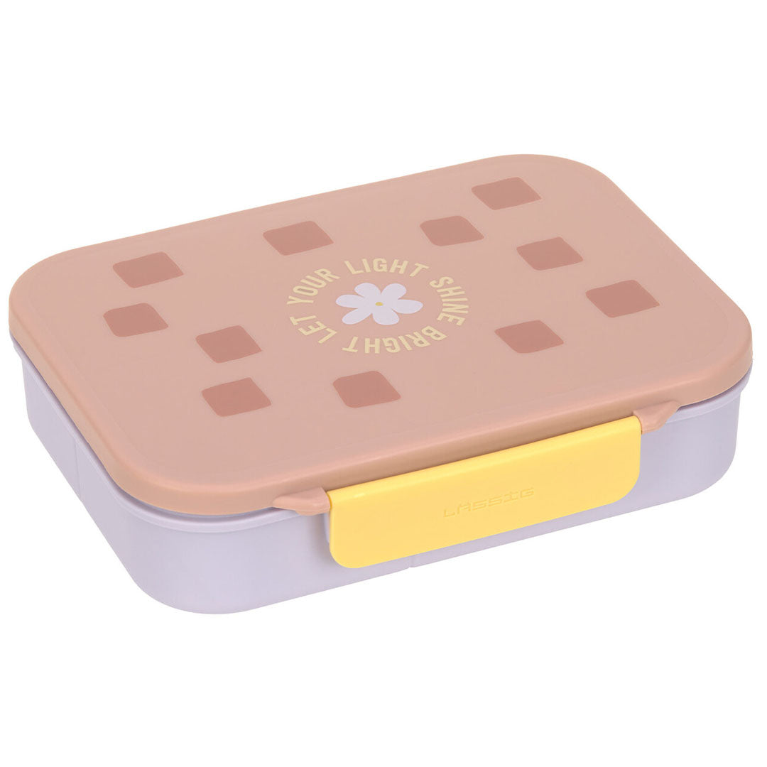 Lässig bento-broodtrommel in roze-lila met een bloem- en tekstpatroon op de deksel.
