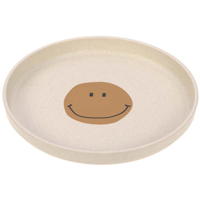Lässig kinderbord met een bruine smiley op een beige achtergrond.
