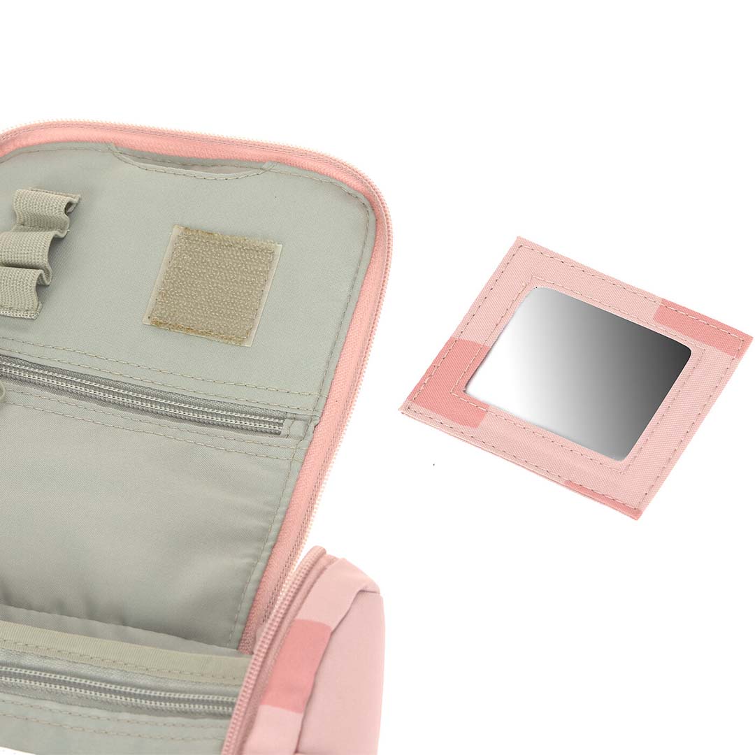 Detail van de uitneembare roze spiegel van de Lässig toilettas.