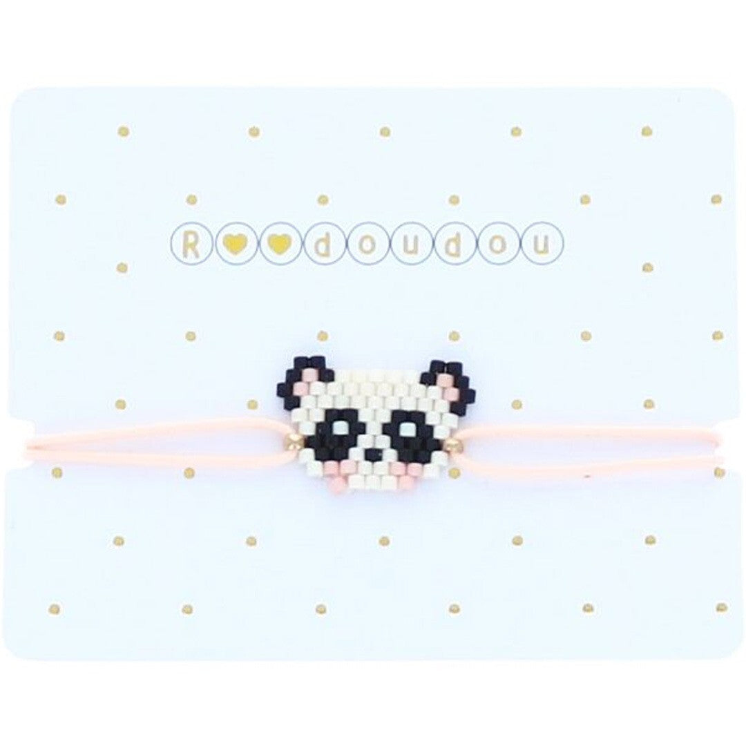 Le Petit Souk kinderarmband met panda gezichtje op een witte verpakking met gouden stippen en de tekst 'Roudoudou'.