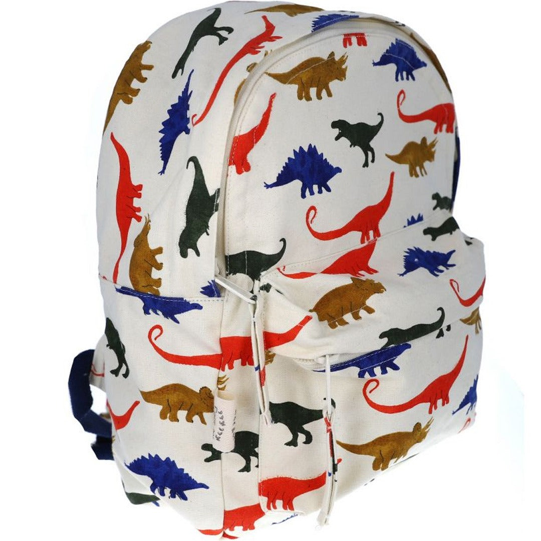 Le petit souk kleuterrugzak met een kleurrijk dinosauruspatroon, schuin van voren gezien.