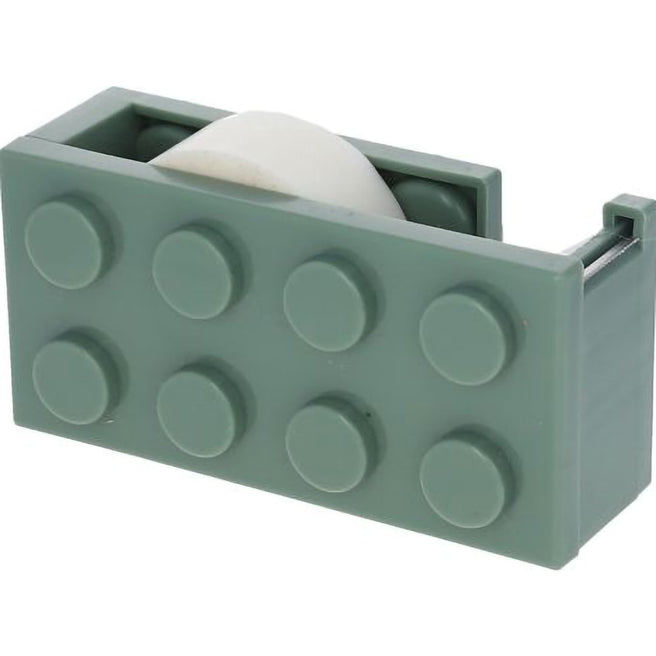 Le petit souk groene plakbandhouder in de vorm van een bouwblok met een rol plakband.
