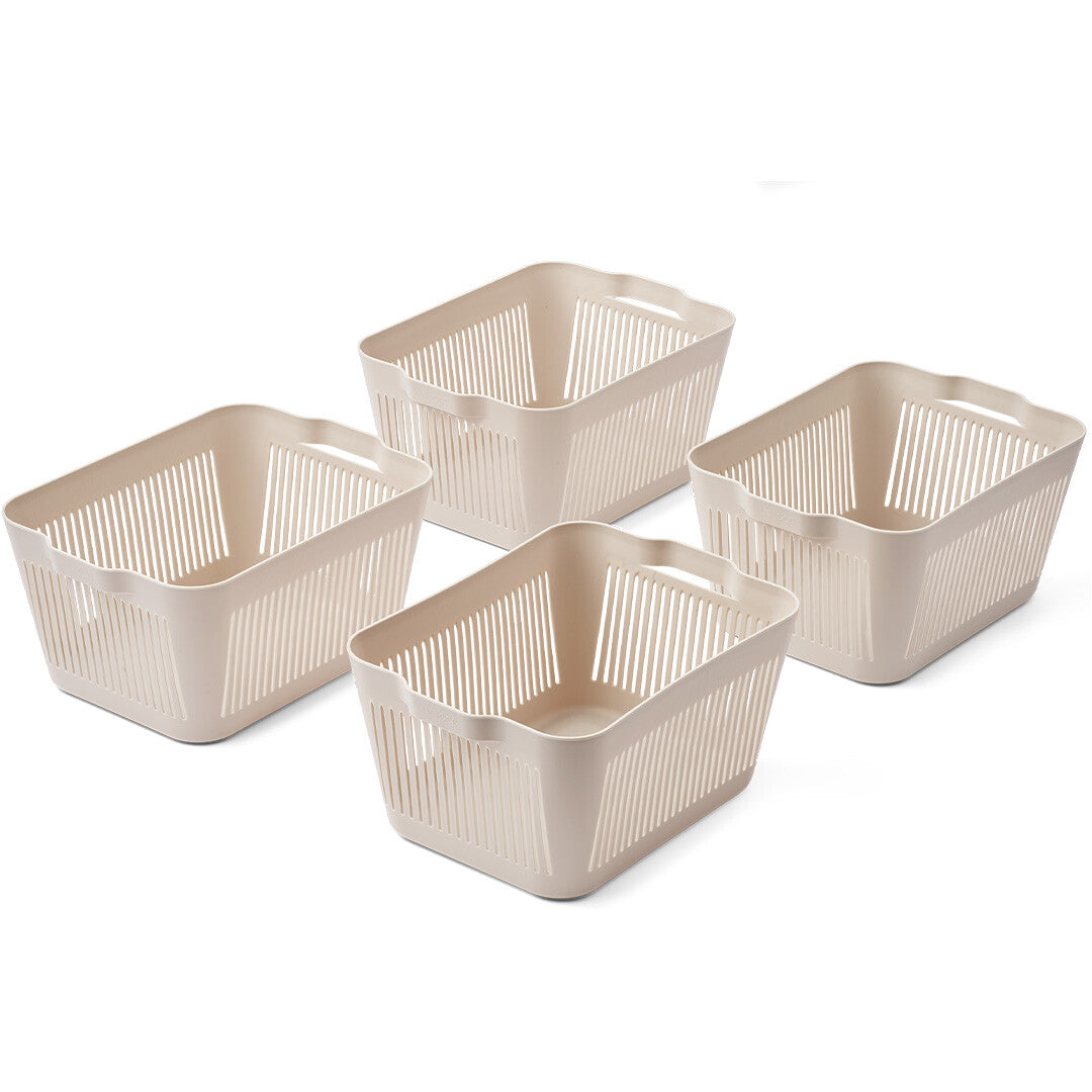 Vier beige Liewood opbergbakken met verticale sleuven.