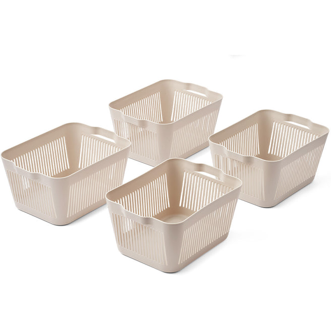 Vier beige Liewood opbergbakken met verticale sleuven.