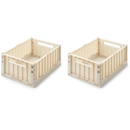 Twee beige Liewood opbergkratten, uitgeklapt en klaar voor gebruik.