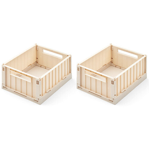 Twee beige Liewood opbergkratten, uitgeklapt en klaar voor gebruik.