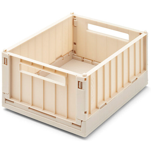 Een enkele beige Liewood opbergkrat, uitgeklapt en leeg.