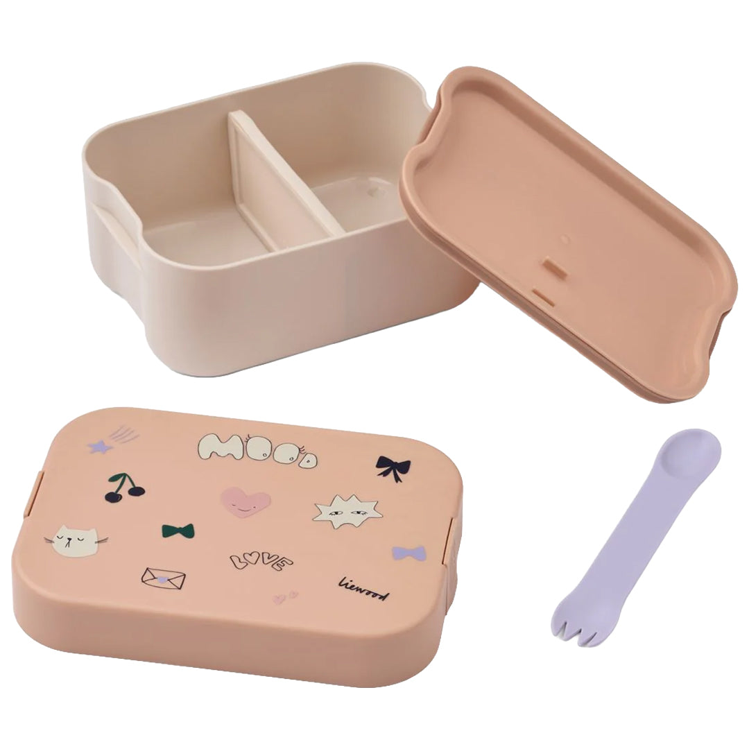 Liewood kinderbroodtrommel in roze en wit, gedemonteerd, met deksel, basis met vakken en een paarse spork.