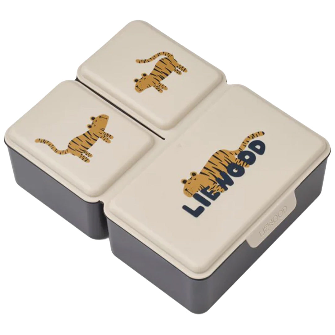 Liewood lunchbox met drie beige deksels met tijgerillustraties en logo.