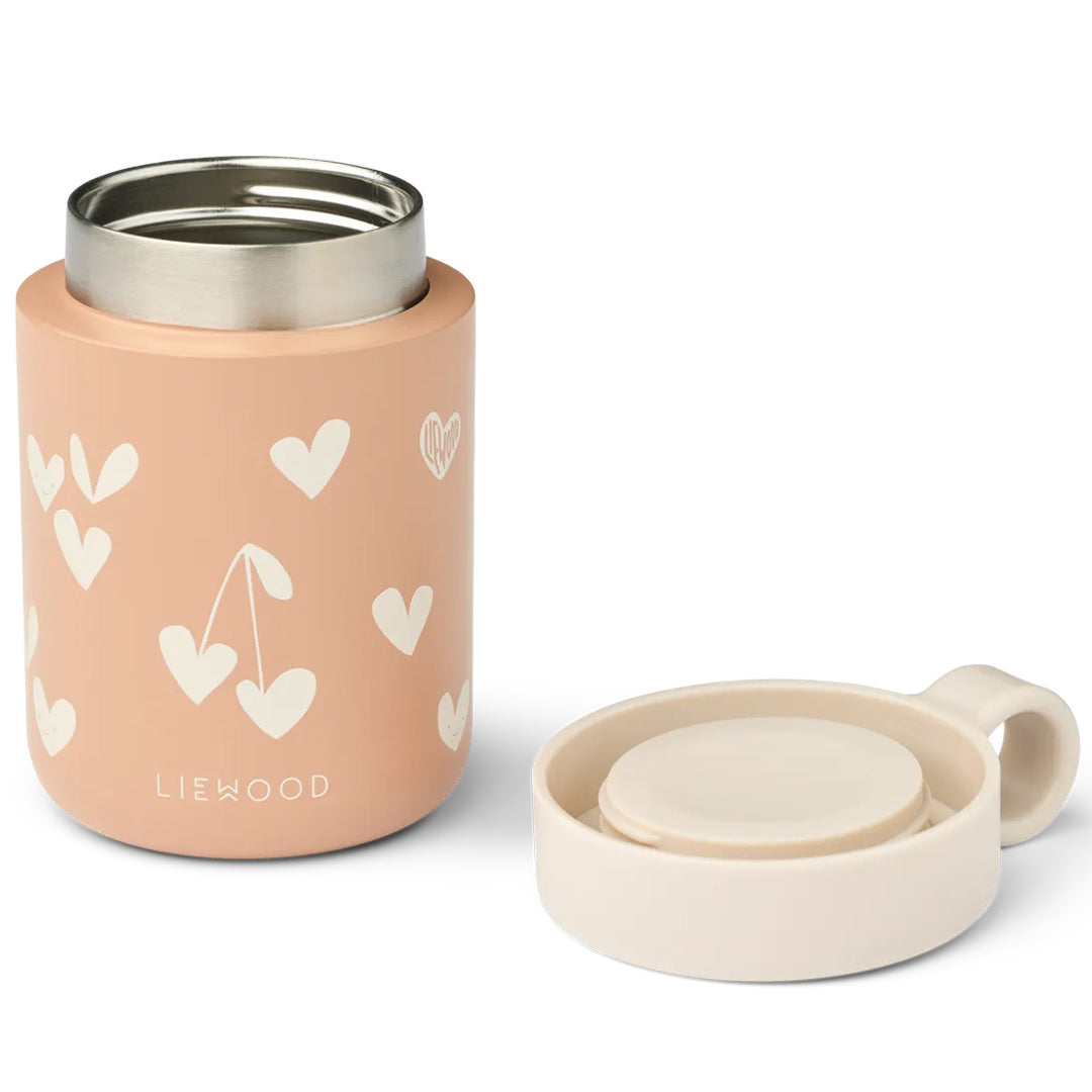 Liewood roze thermoscontainer met harten en kersenpatroon, open met de deksel ernaast.