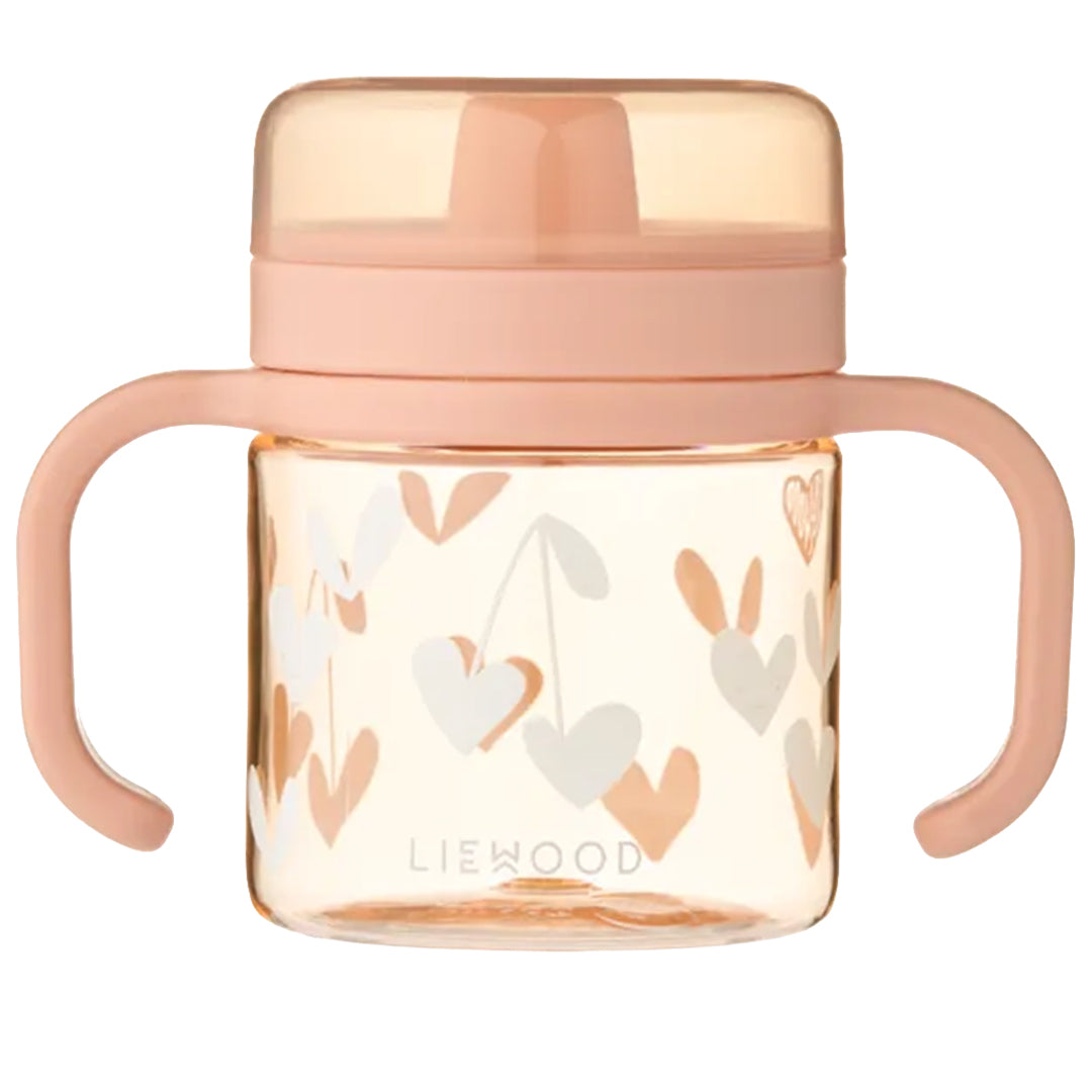 Liewood tuitbeker Kylo voor baby's en peuters, in pale tuscany met witte harten en twee handvatten.