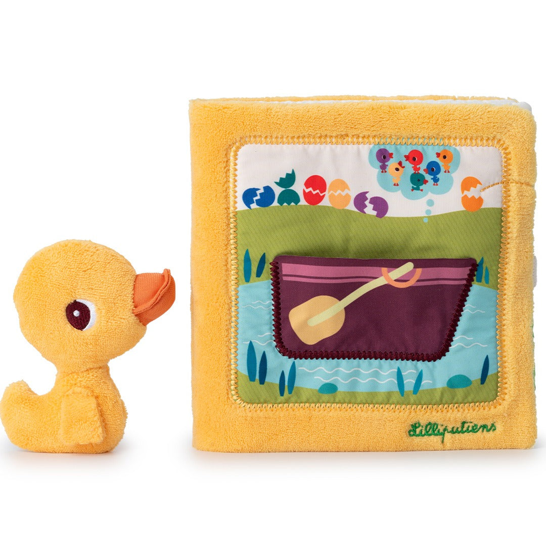 Lilliputiens activiteitenboek met een losse gele knuffeleend ernaast.