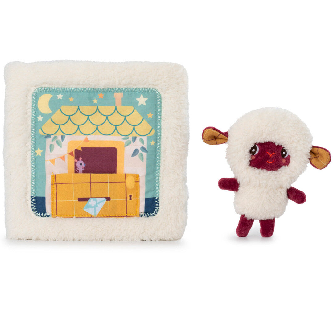 Lilliputiens babyspeelgoed activiteitenboek met het schaap Yvon vingerpopje ernaast.