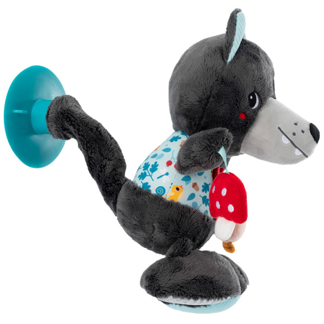 Zijaanzicht van de Lilliputiens activiteitenknuffel Louis de wolf met een paddenstoel en een blauwe zuignap aan de achterkant.