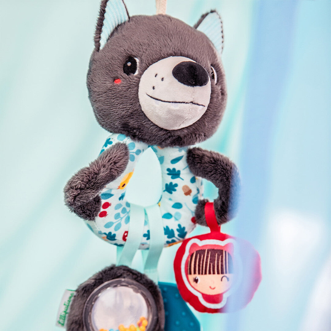 Lilliputiens activiteitenring Louis de wolf, een grijze rammelaar voor baby's met een vrolijk gezicht en diverse texturen.
