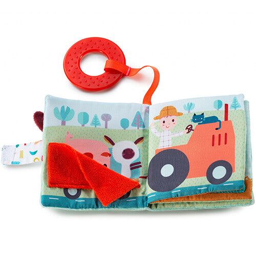 Een open Lilliputiens babyspeelgoed kijk- en speelboekje boerderij met een varken, schaap en een jongen op een tractor.