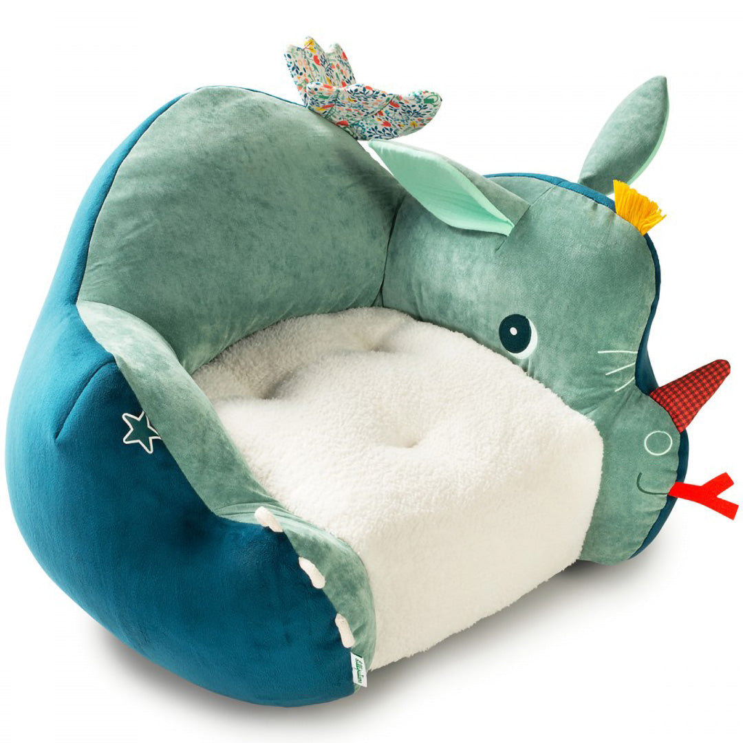 Lilliputiens kinderfauteuil Joe in de vorm van een groene neushoorn met een zachte witte zitting.