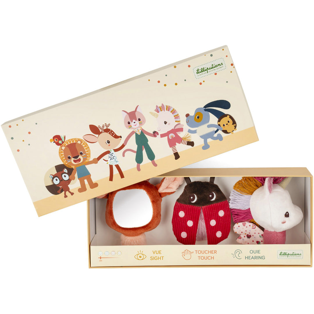 Lilliputiens sensorische rammelaars set met hert, lieveheersbeestje en eenhoorn in de geopende verpakking.