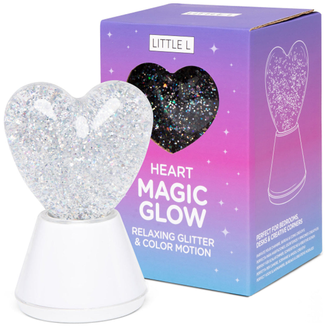 Het little l hartjes nachtlampje naast de paars-blauwe verpakking met de tekst "Heart Magic Glow".