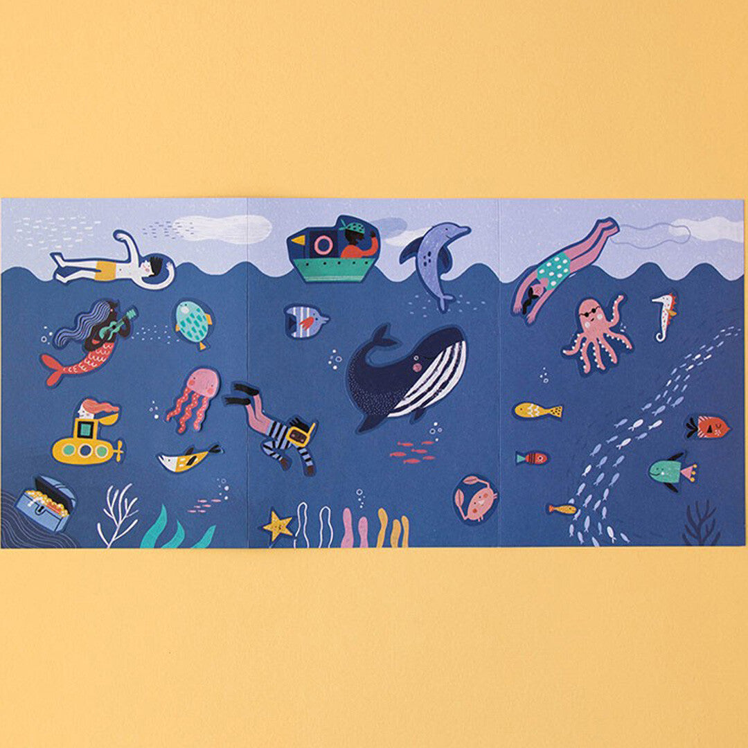 Een demonstratie van de Londji herbruikbare stickers met een onderwaterwereld thema, inclusief walvis, dolfijn, zeemeermin en duikers.