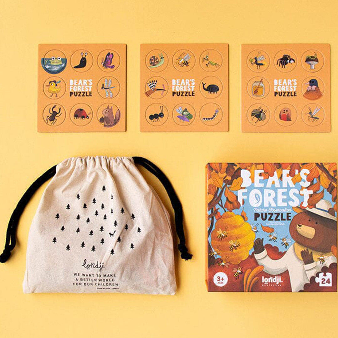 De Londji Bear's Forest puzzelset met verpakking, stoffen zak en vellen met zoekfiches.
