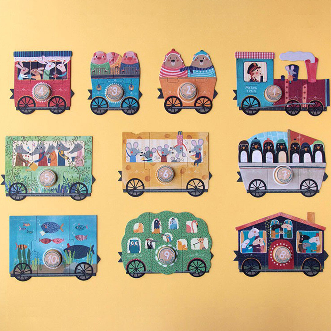 Tien losse Londji My Little Train puzzelstukken, elk een treinwagon met dieren en een nummer, op een gele achtergrond.