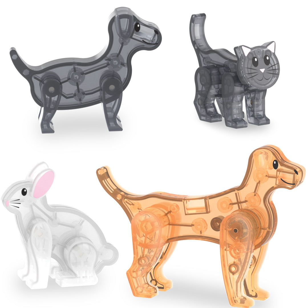 Vier transparante dierenfiguren van de Magna-Tiles Pet Playhouse bouwset: twee honden, een kat en een konijn.