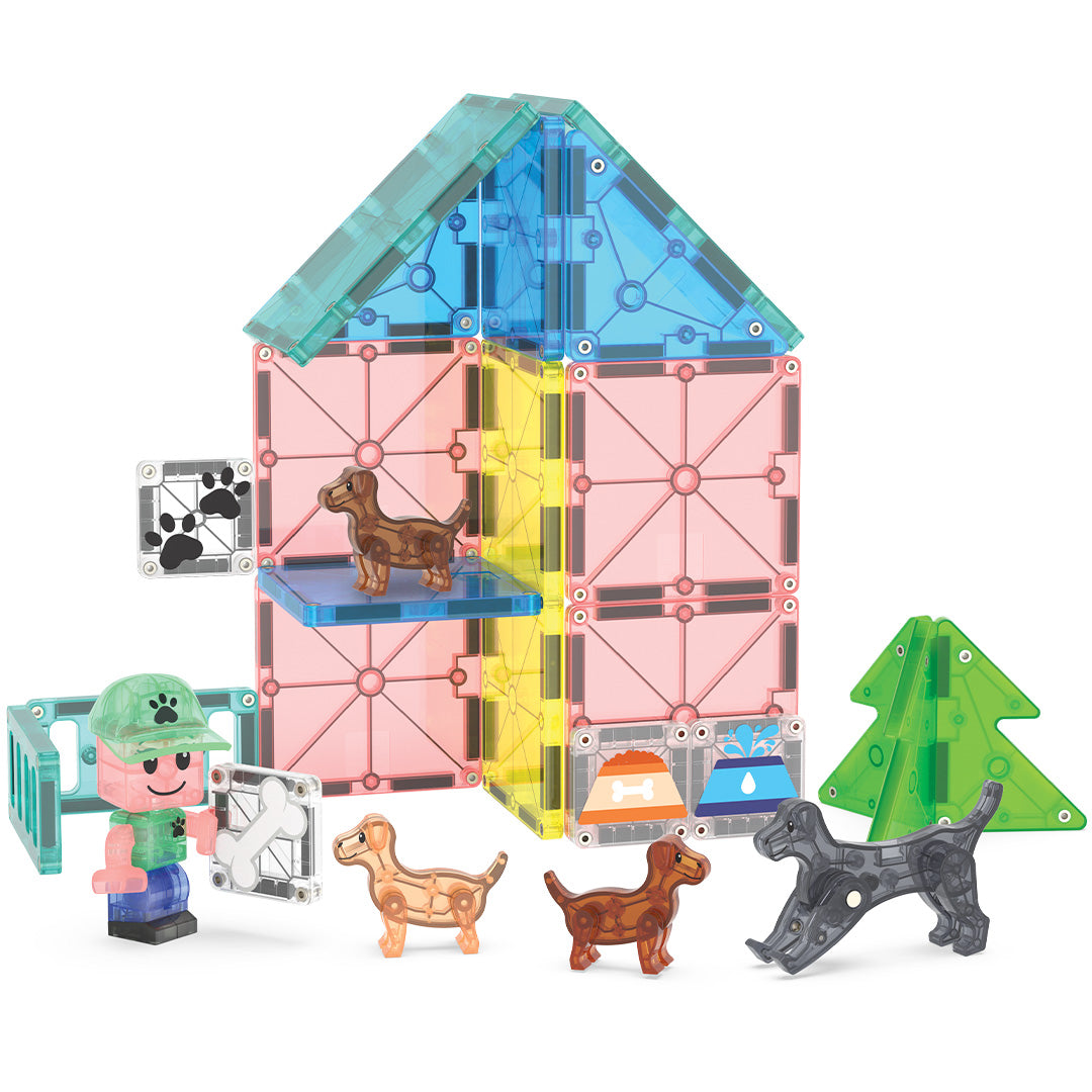 Magna-Tiles Puppy Park bouwset met een huis, hek, boom, kindfiguur en puppy's van magnetische tegels.