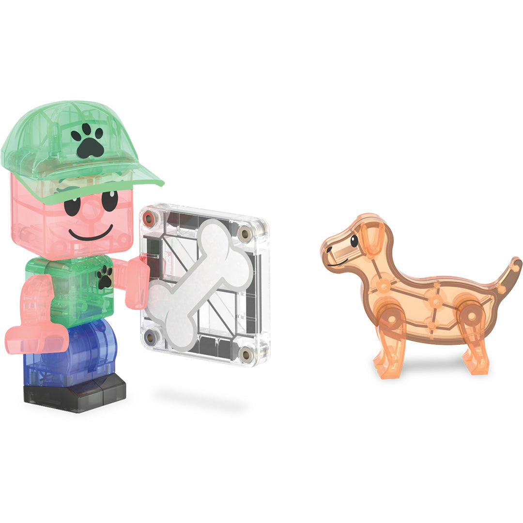 Detail van een kindfiguur met een bottegel en een puppyfiguur van de Magna-Tiles bouwset.