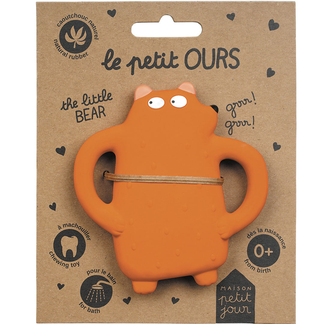 De verpakking van het Maison Petit Jour bijtspeelgoed in de vorm van een oranje beer.