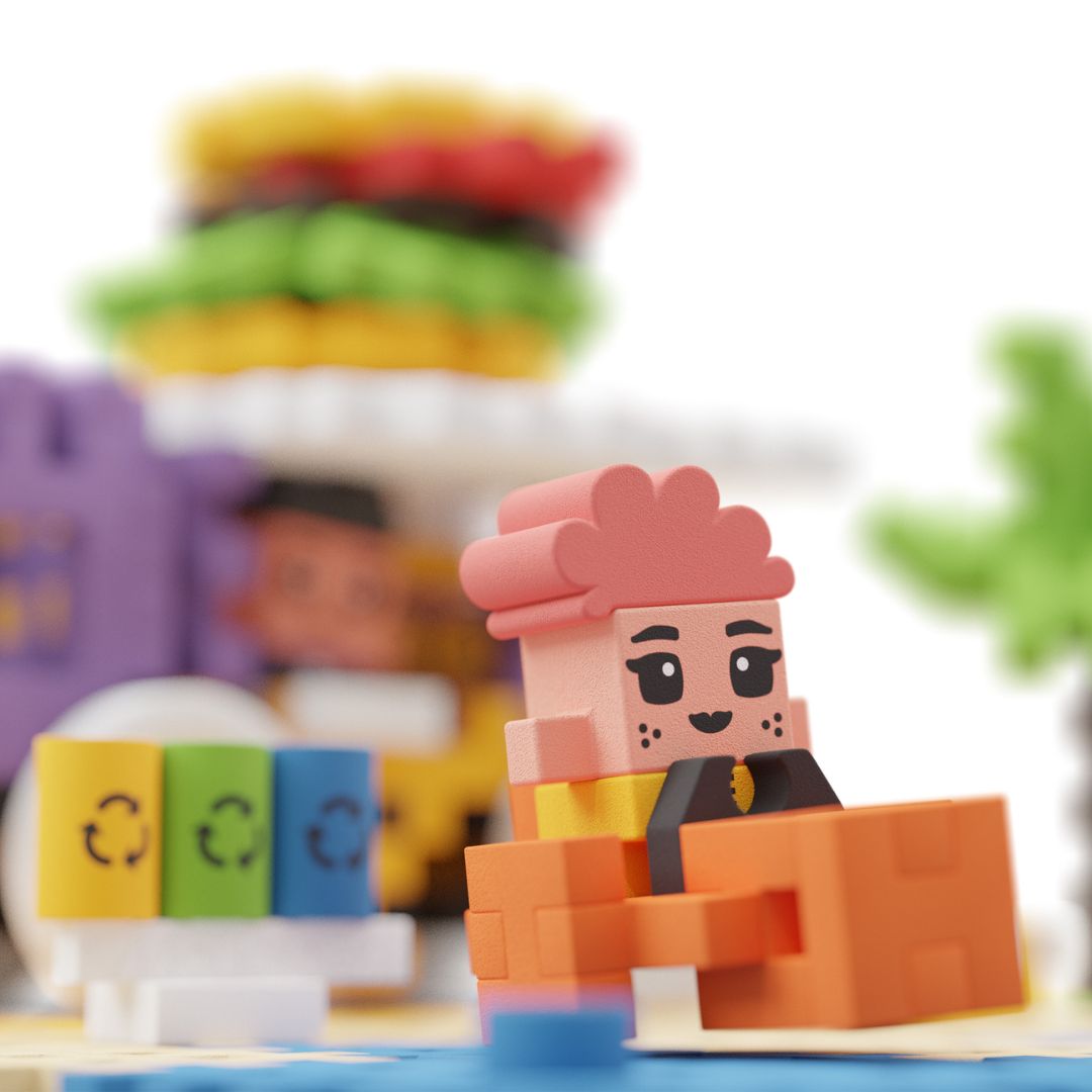 Detailfoto van een bouwblokken figuur met roze haren zittend op een oranje blok.