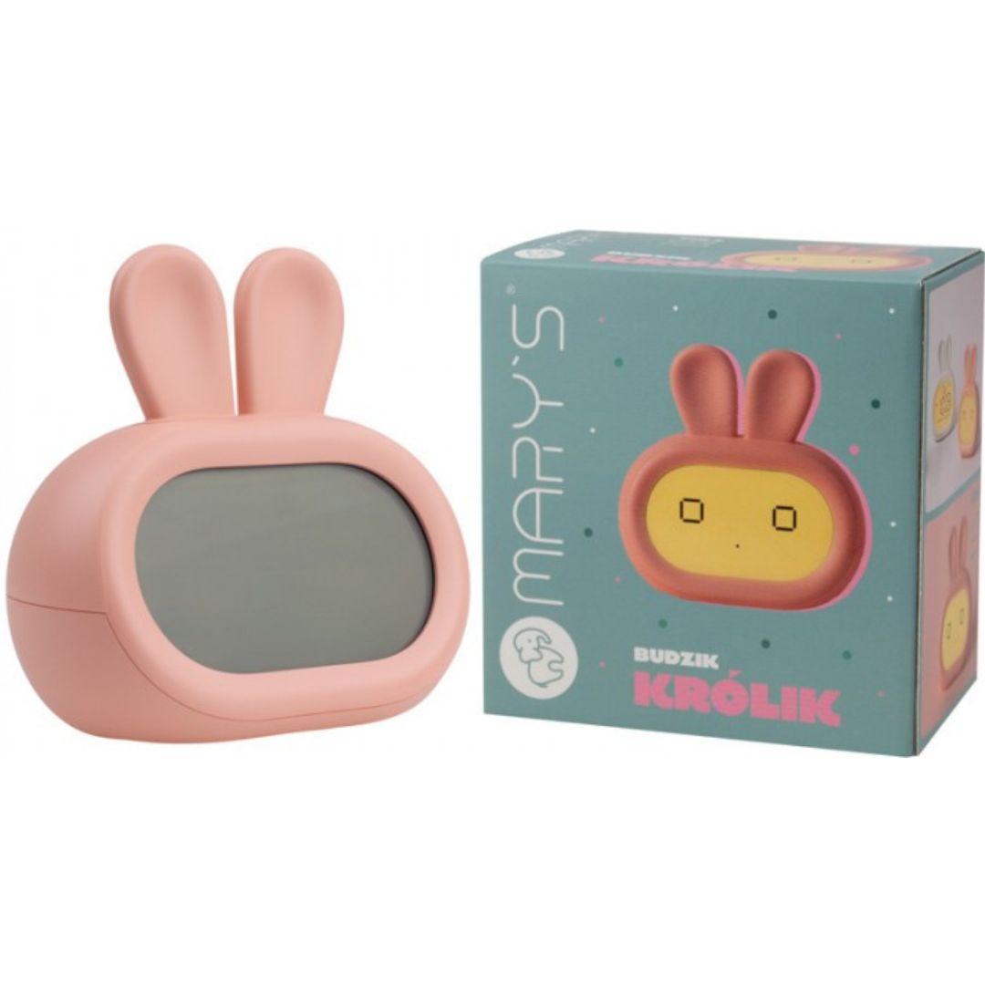 Mary's roze kinderwekker in konijnvorm naast de productverpakking.