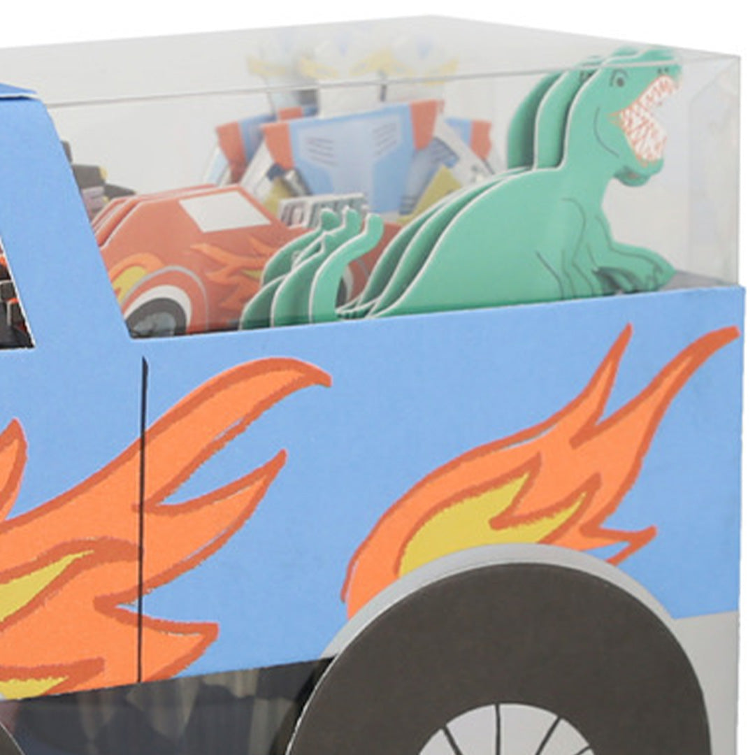 Detail van de meri meri monster truck cupcake set verpakking met een dinosaurus en robot topper.