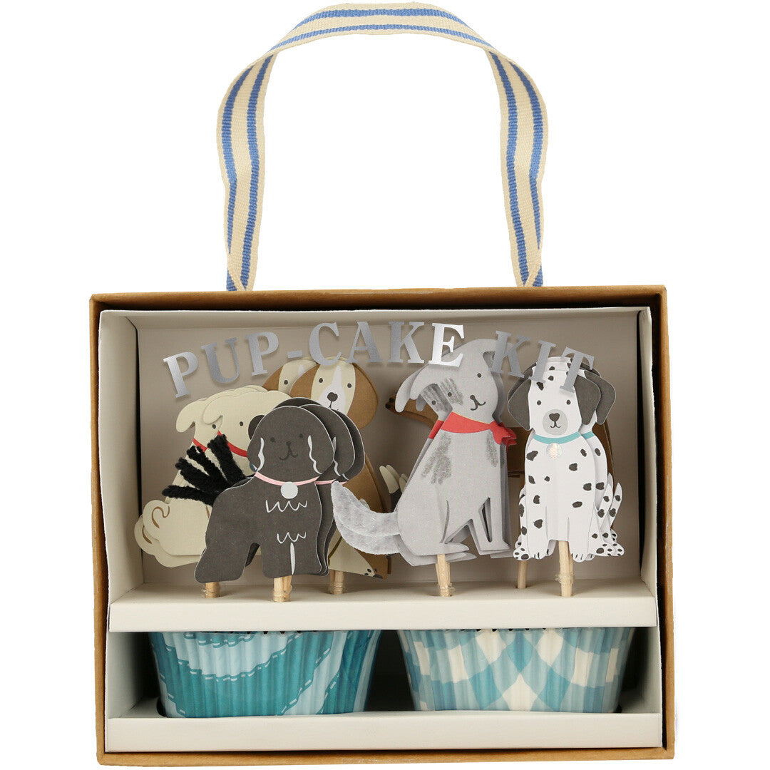 Meri Meri cupcake set puppy in de verpakking, met diverse honden toppers en blauwe cupcake vormpjes.