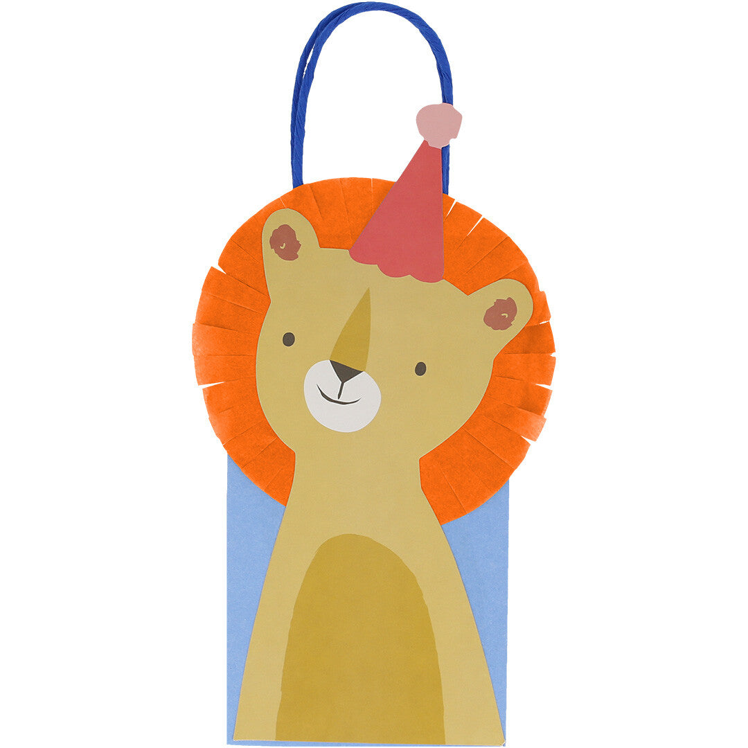 Een feesttasje met een leeuw met oranje manen en een roze feesthoedje.
