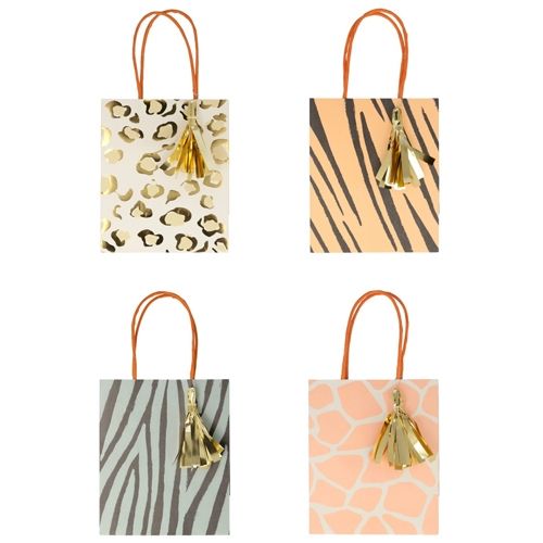 Vier meri meri cadeautasjes met verschillende dierenprints en gouden kwastjes.