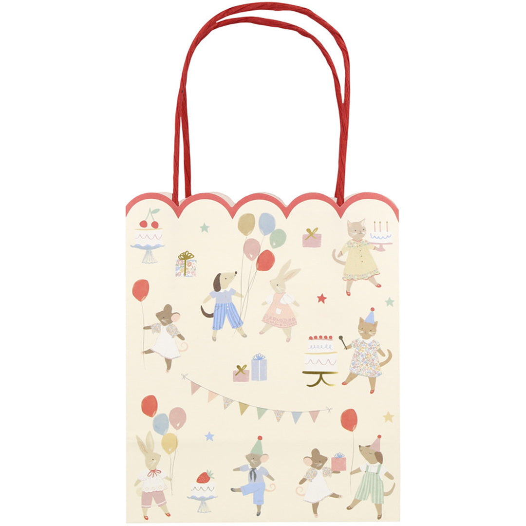 Meri Meri feesttasje met een beige achtergrond en illustraties van feestvierende dieren met ballonnen en cadeaus.