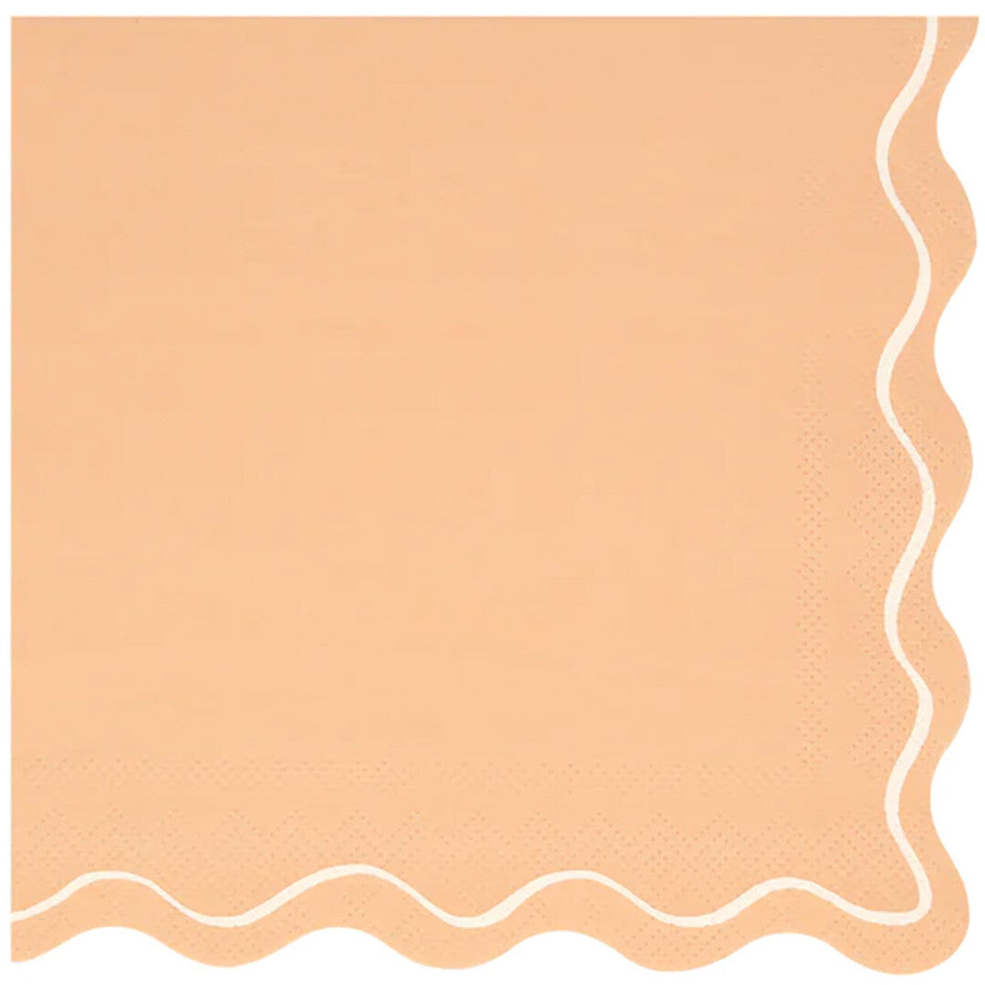Close-up van een oranje Meri Meri papieren servet met een golvende witte rand.