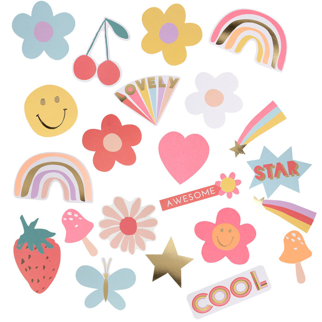Een verzameling Meri Meri stickers in verschillende vormen zoals bloemen, regenbogen, sterren en een aardbei.