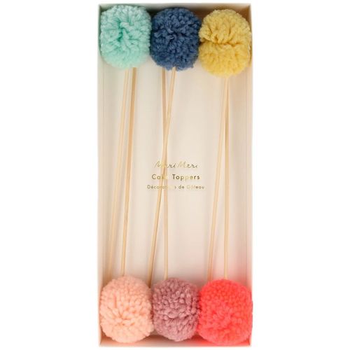 Verpakking van de Meri Meri pompom taartversiering met zes gekleurde pompoms.