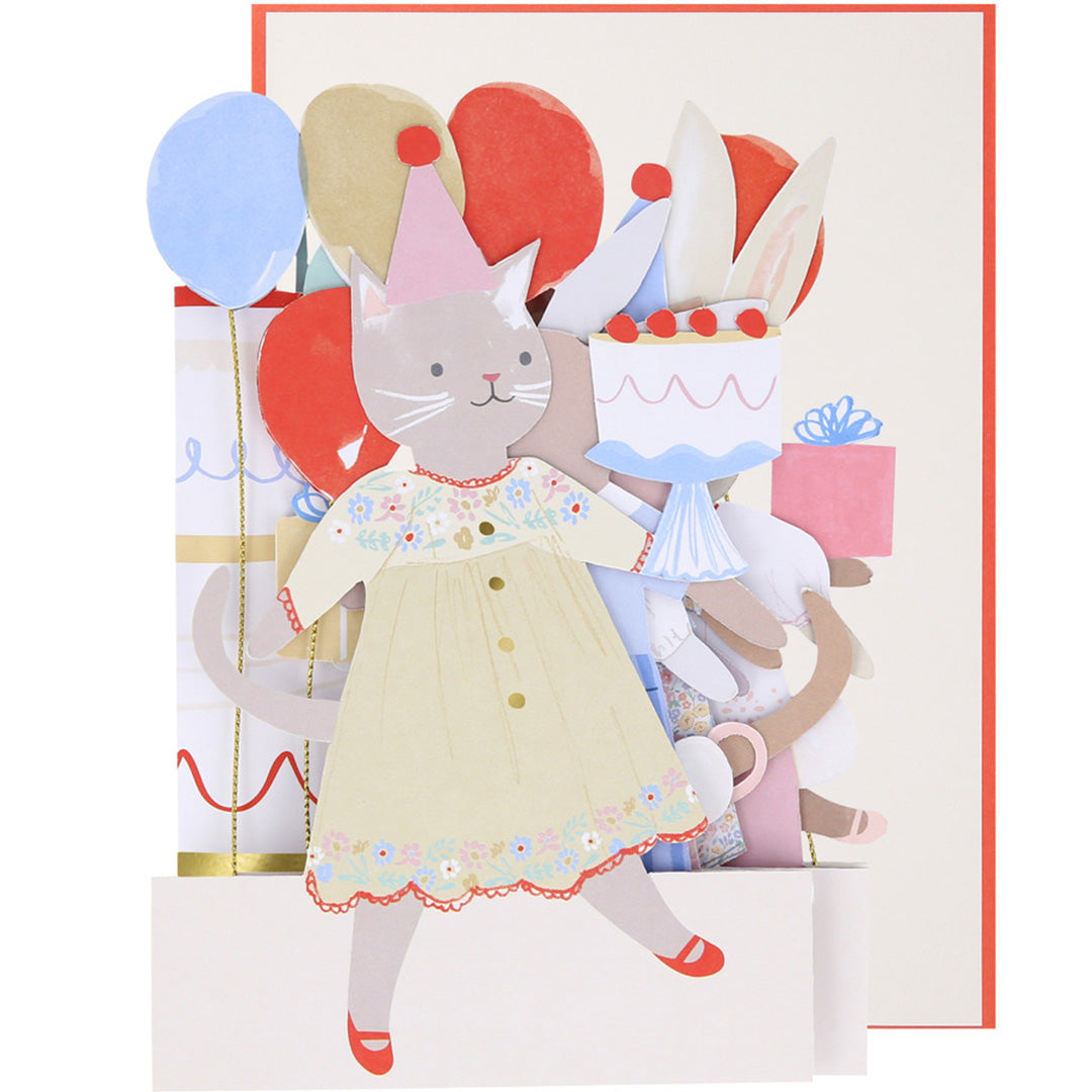 Meri Meri pop-up verjaardagskaart met een kat die een taart vasthoudt en andere feestende dieren op de achtergrond.