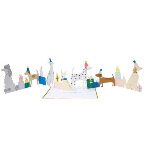 Meri Meri verjaardagskaart met uitklapbare hondenfiguren en cadeautjes in een feestelijke opstelling.