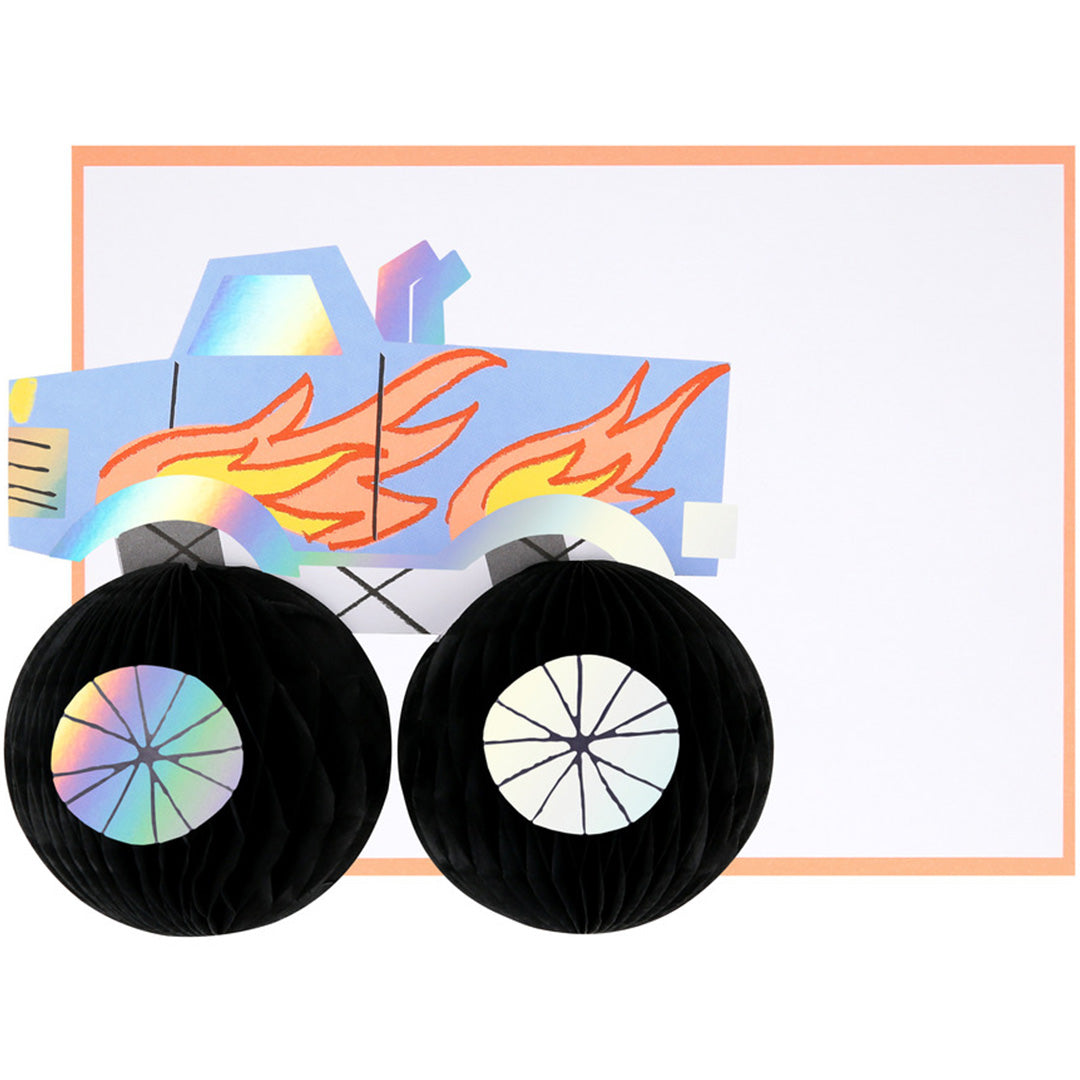 Meri Meri verjaardagskaart met een blauwe monster truck en zwarte honingraatwielen, met ruimte voor tekst.