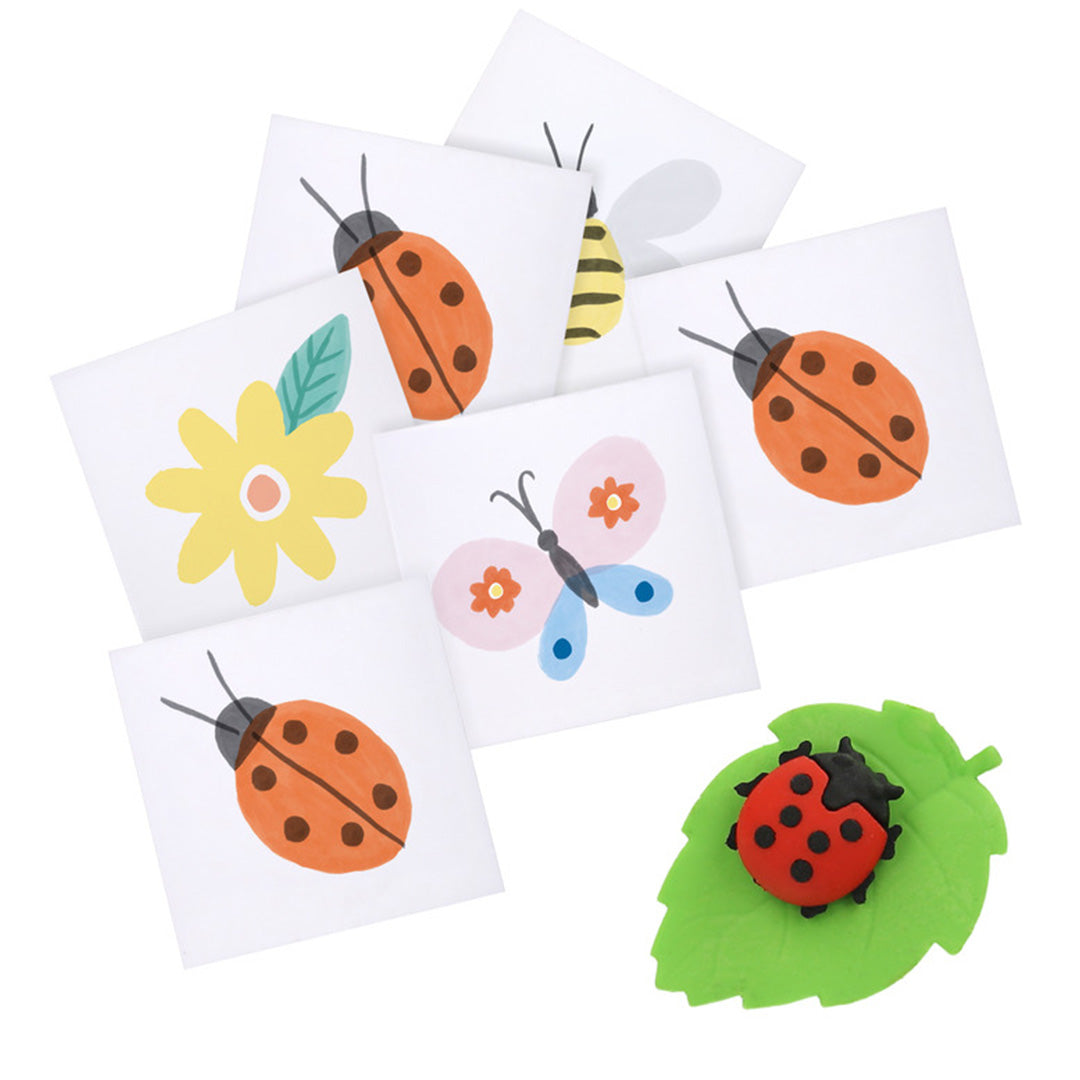 Een collectie kleine illustraties van lieveheersbeestjes, een vlinder, een bij en een bloem, met een lieveheersbeestje gum op een groen blaadje.
