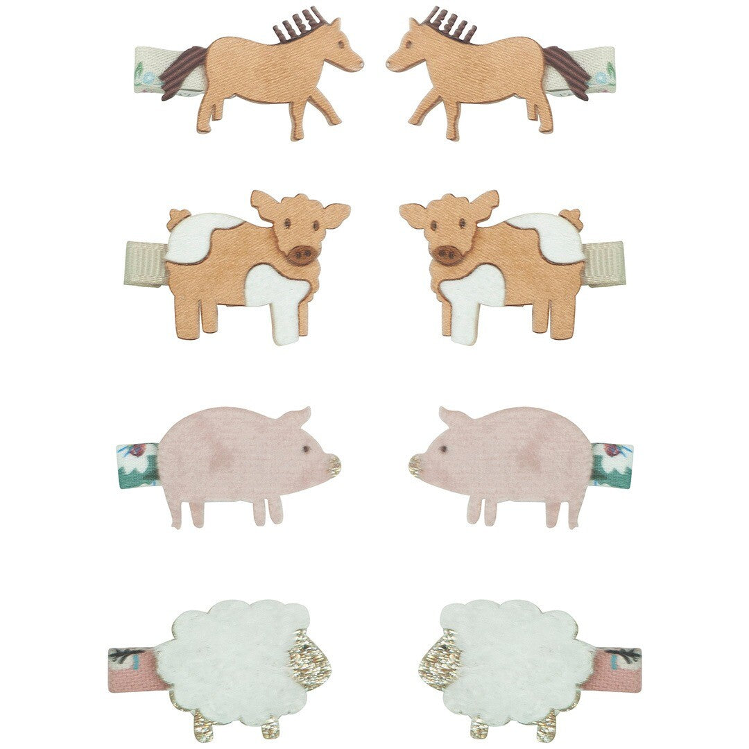 Mimi & Lula haarclipjes met boerderijdieren, waaronder paarden, koeien, varkens en schapen, op een witte achtergrond.